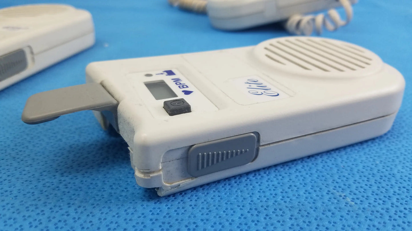 White plastic oricom handheld intercom with gray accents and small digital display in lot of 3 natus neurology elite medical equipment