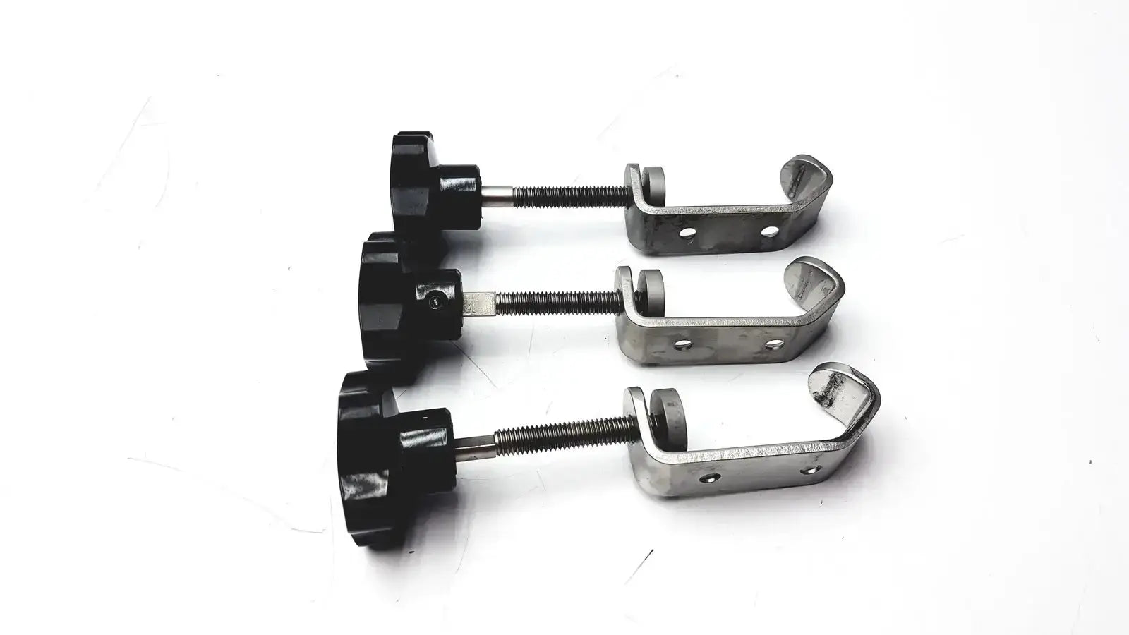Black plastic knob with threaded metal shaft and silver stainless steel u-shaped bracket for tube slot pipe clamp