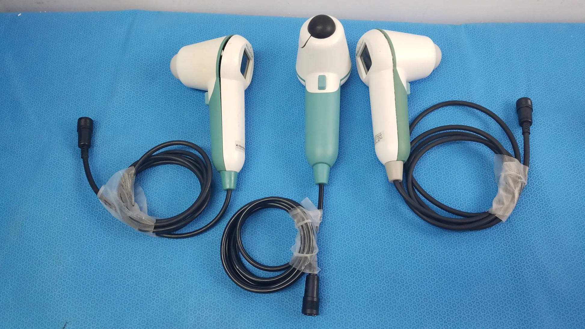 Lot of 3 verathon bladderscan medical equipment handheld ultrasound probes in white and teal with black cords for reuse medical equipment