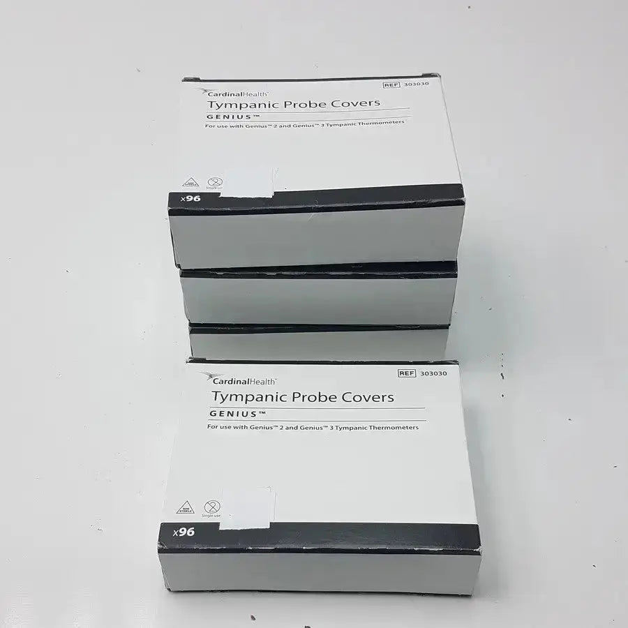 White cardboard boxes of cardinal health genius tympanic probe covers for use with genius tympanic thermometers lot of 4