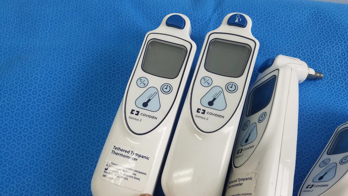 Lot of 4 white coviden genius 2 tethered tympanic thermometers with blue accents digital displays medical equipment reuse medical
