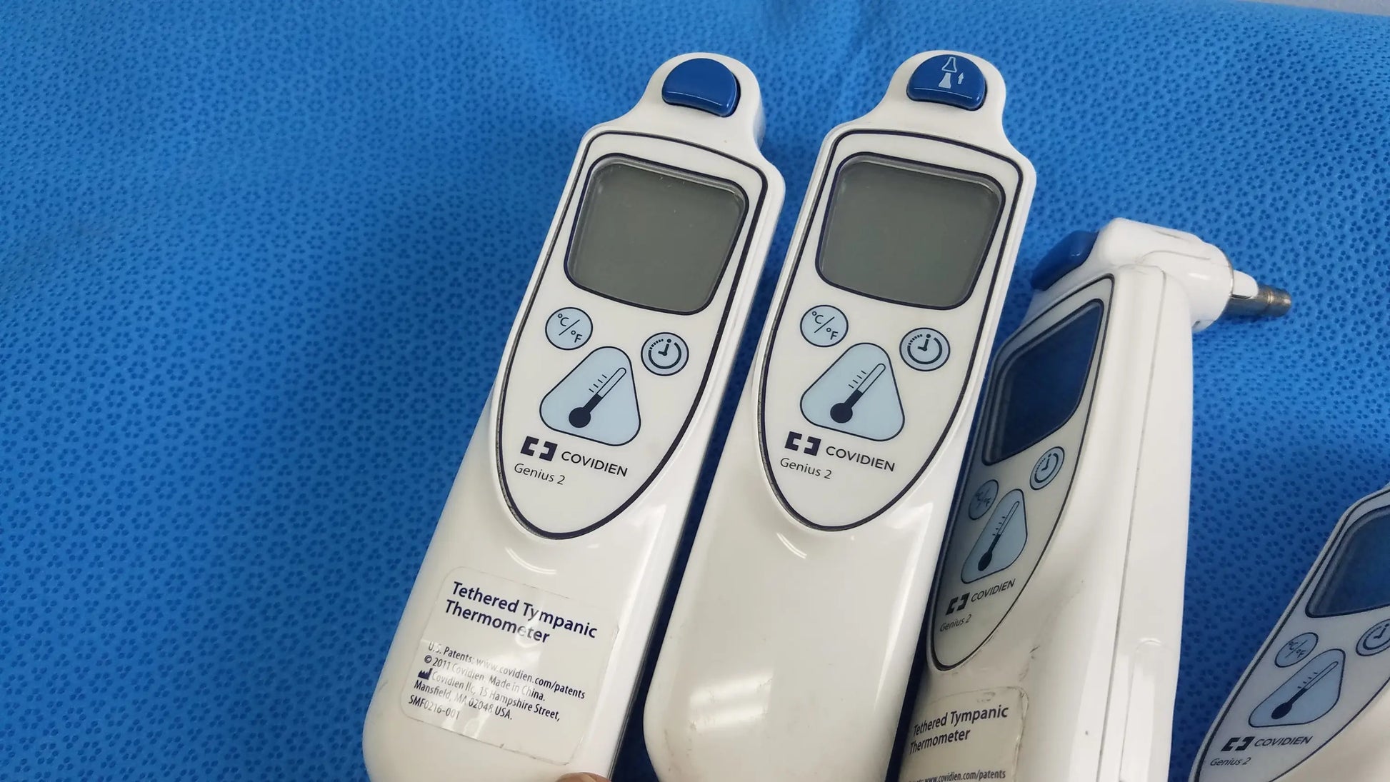 Lot of 4 white coviden genius 2 tethered tympanic thermometers with blue accents digital displays medical equipment reuse medical
