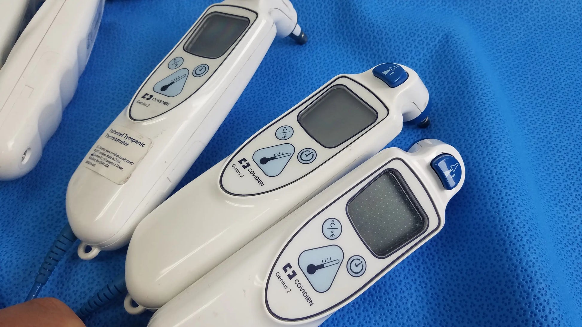 Lot of 4 copernic white non-contact infrared thermometers with blue buttons digital displays for reuse medical equipment