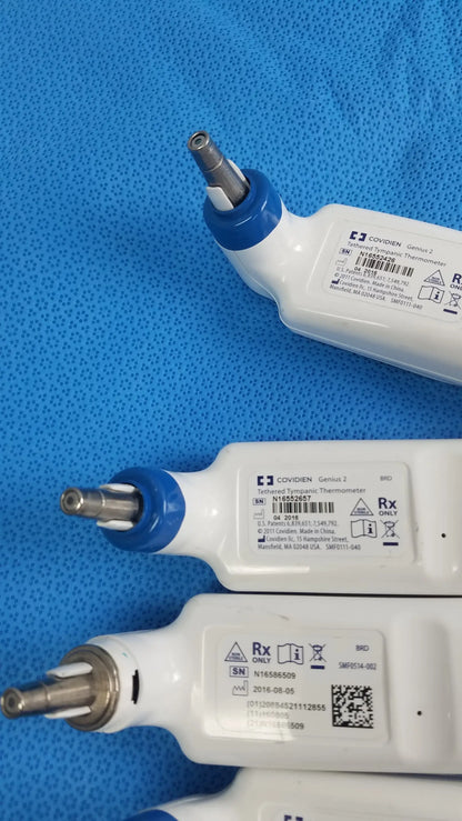 Lot of 4 coviden genius 2 tethered tympanic thermometers in white and blue with ergonomic design for reuse medical equipment