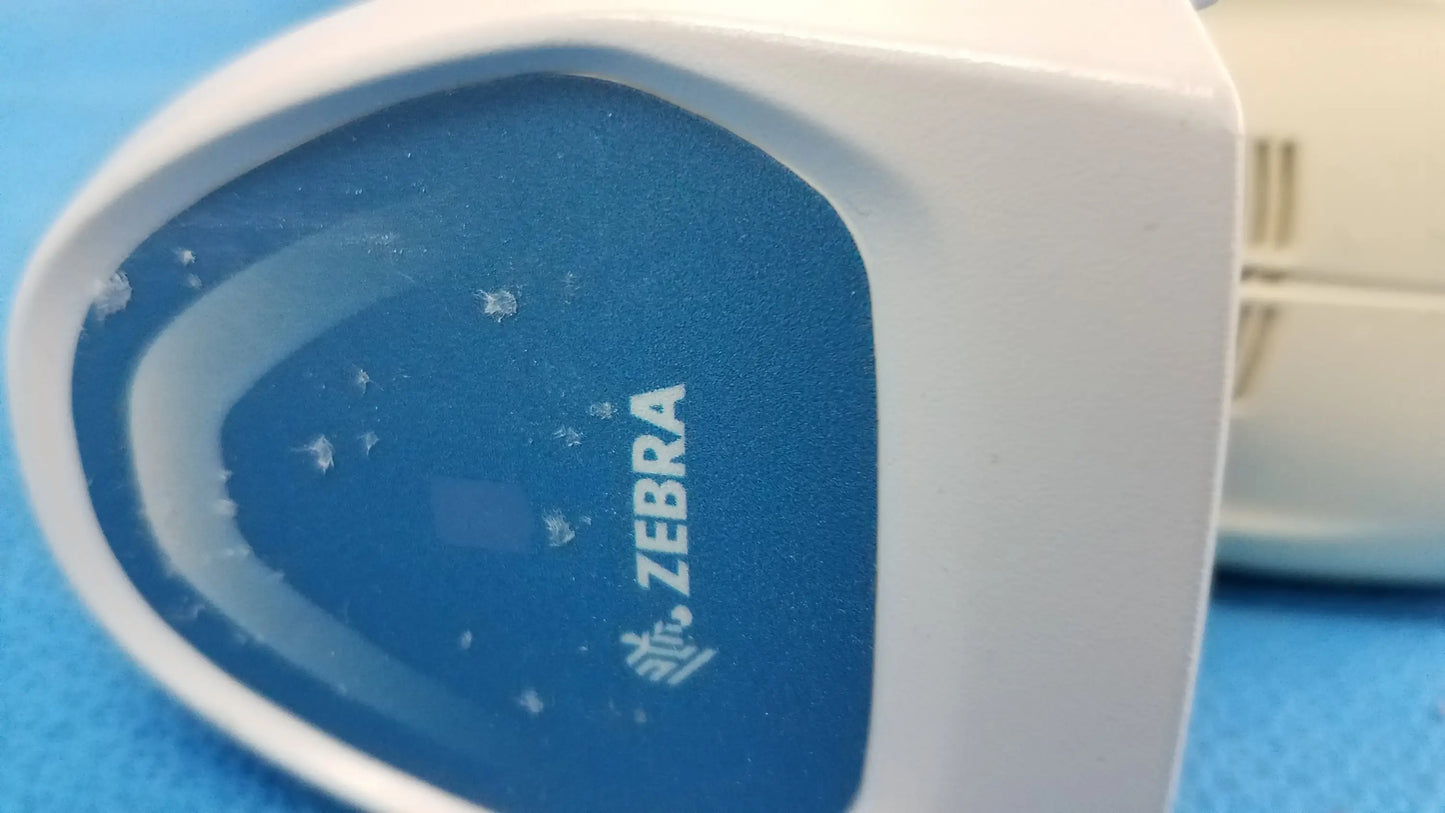 Lot of 4 laser barcode scanner reader with white and blue zebra label printer featuring a glossy finish for reuse medical equipment