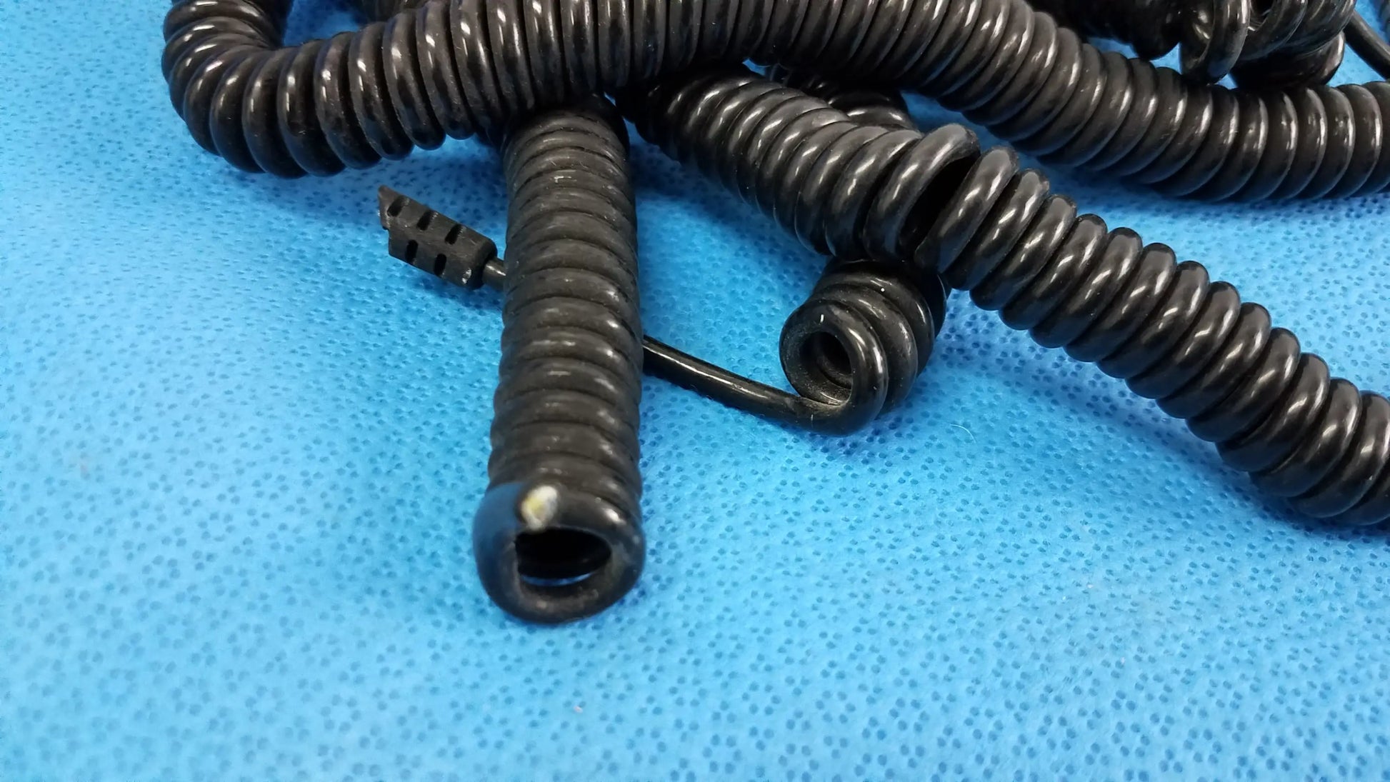 Black spiral-coiled cable with molded connector end for wall transformer reuse medical equipment in lot of 5 assemblies