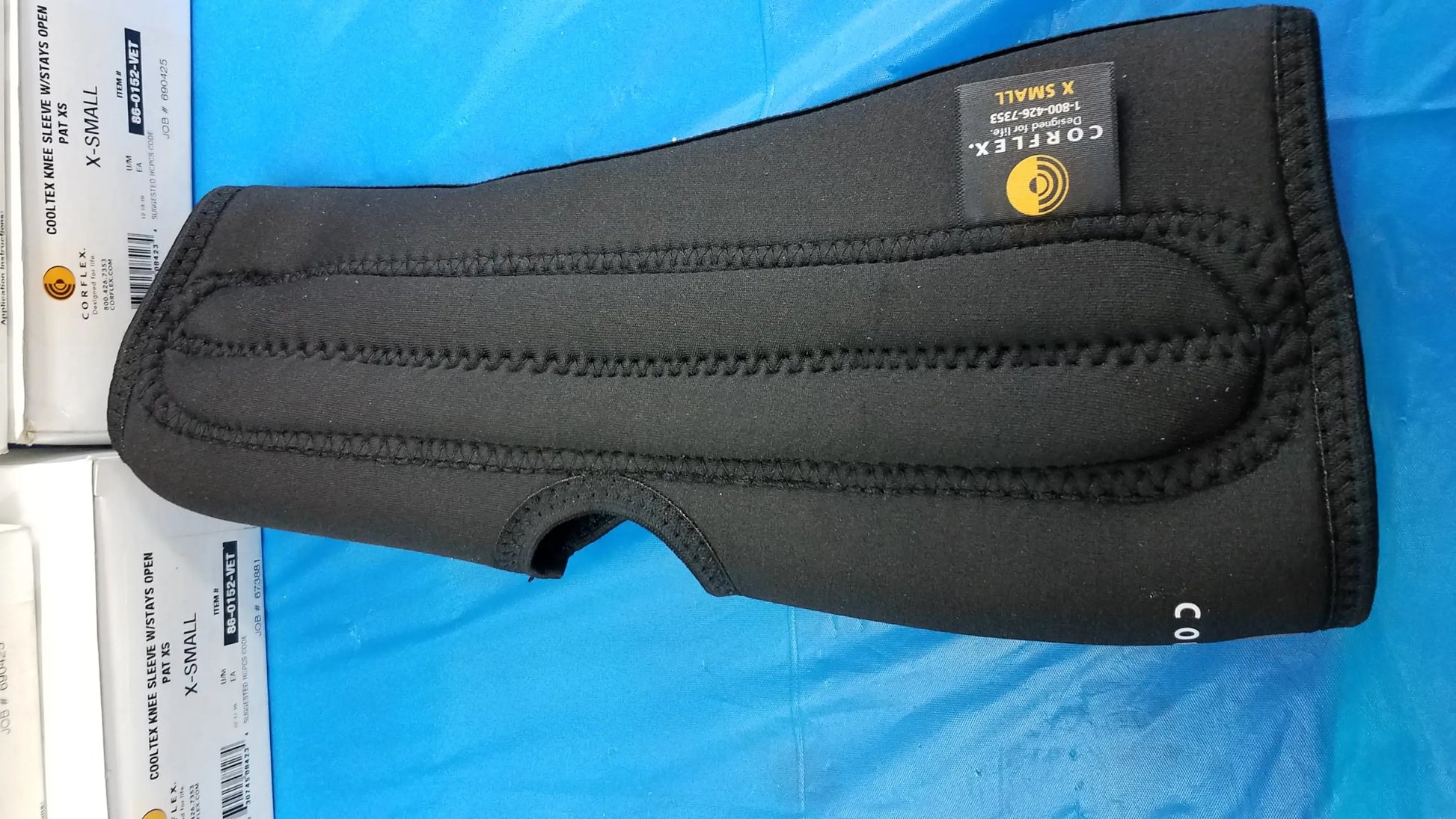 Black neoprene corteflex x-small counter wrist sleeve with reinforced stitching and branded label for reuse medical equipment