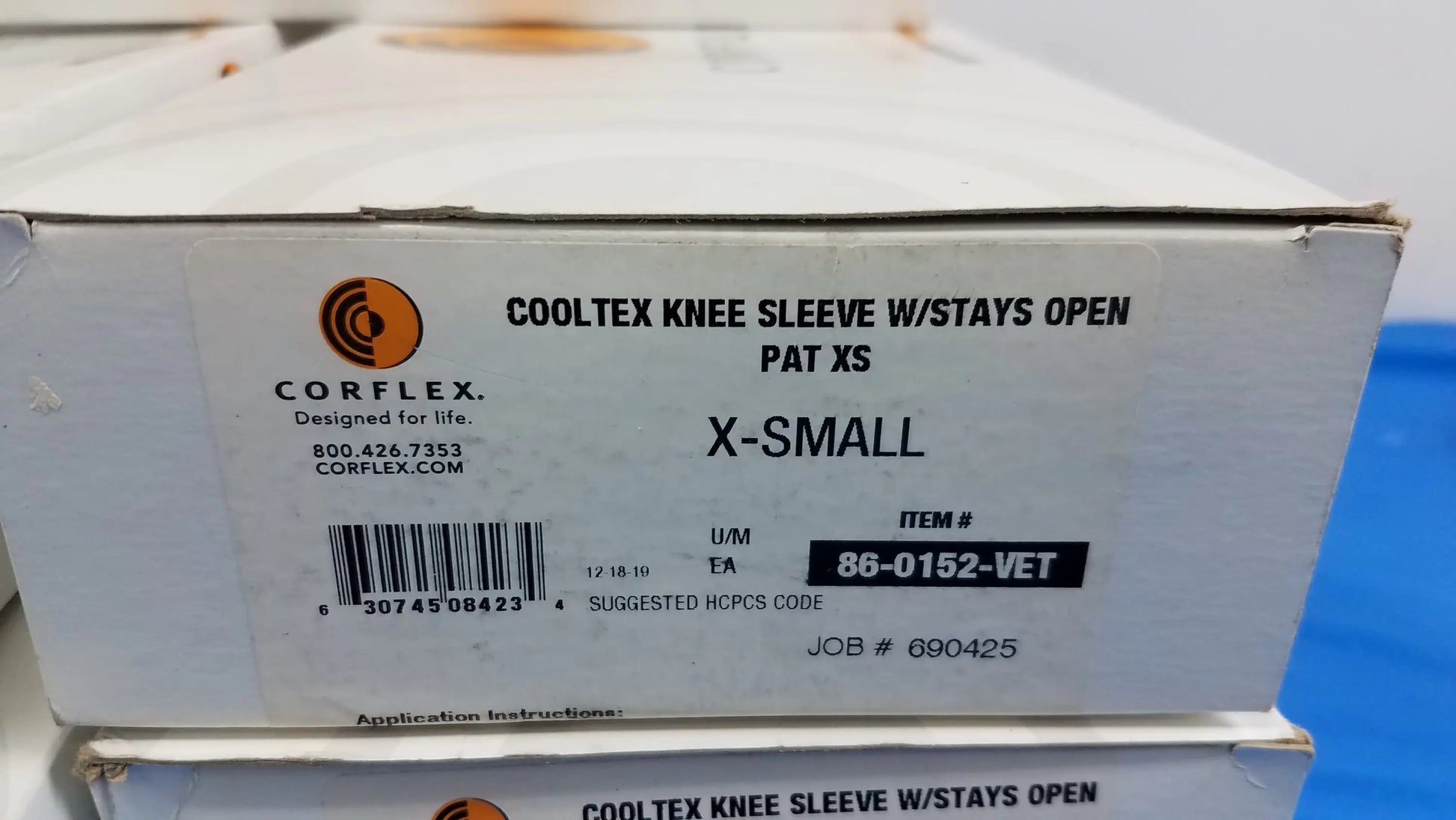 White cardboard box of corflex cooltex knee sleeve medical equipment with stays open pat xs for reuse medical equipment