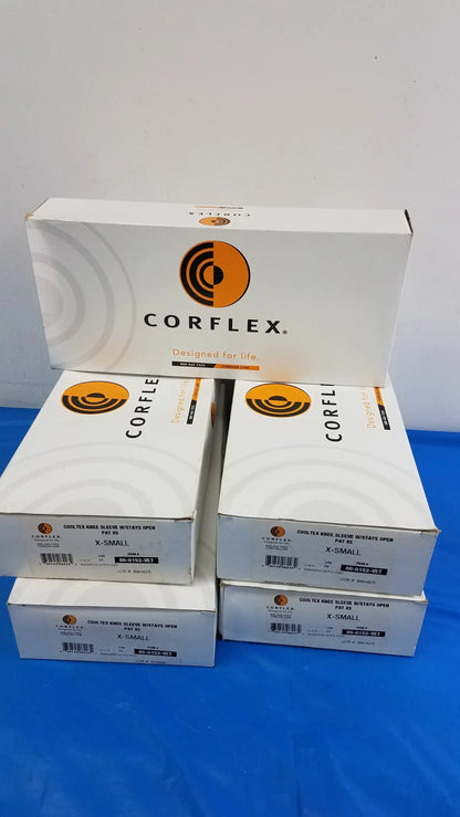 White cardboard boxes of corflex cooltex knee sleeve inserts in x-small with orange logo for reuse medical equipment