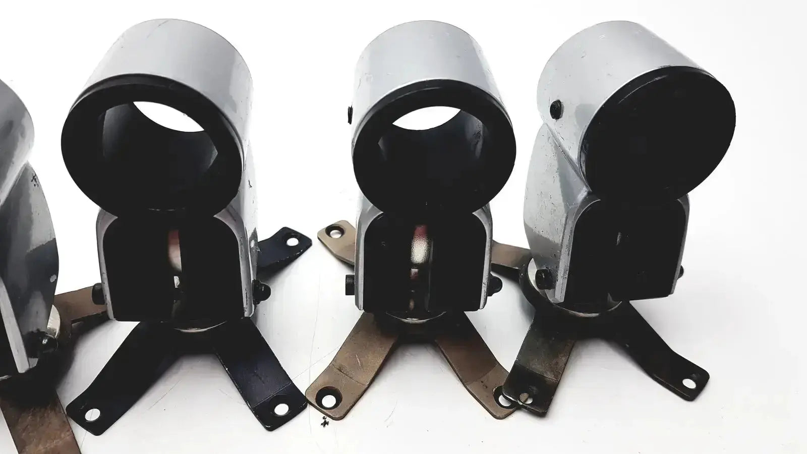 Three silver metal clamps with black interiors and mounting brackets from hospital surplus equipment clamps lot of 5