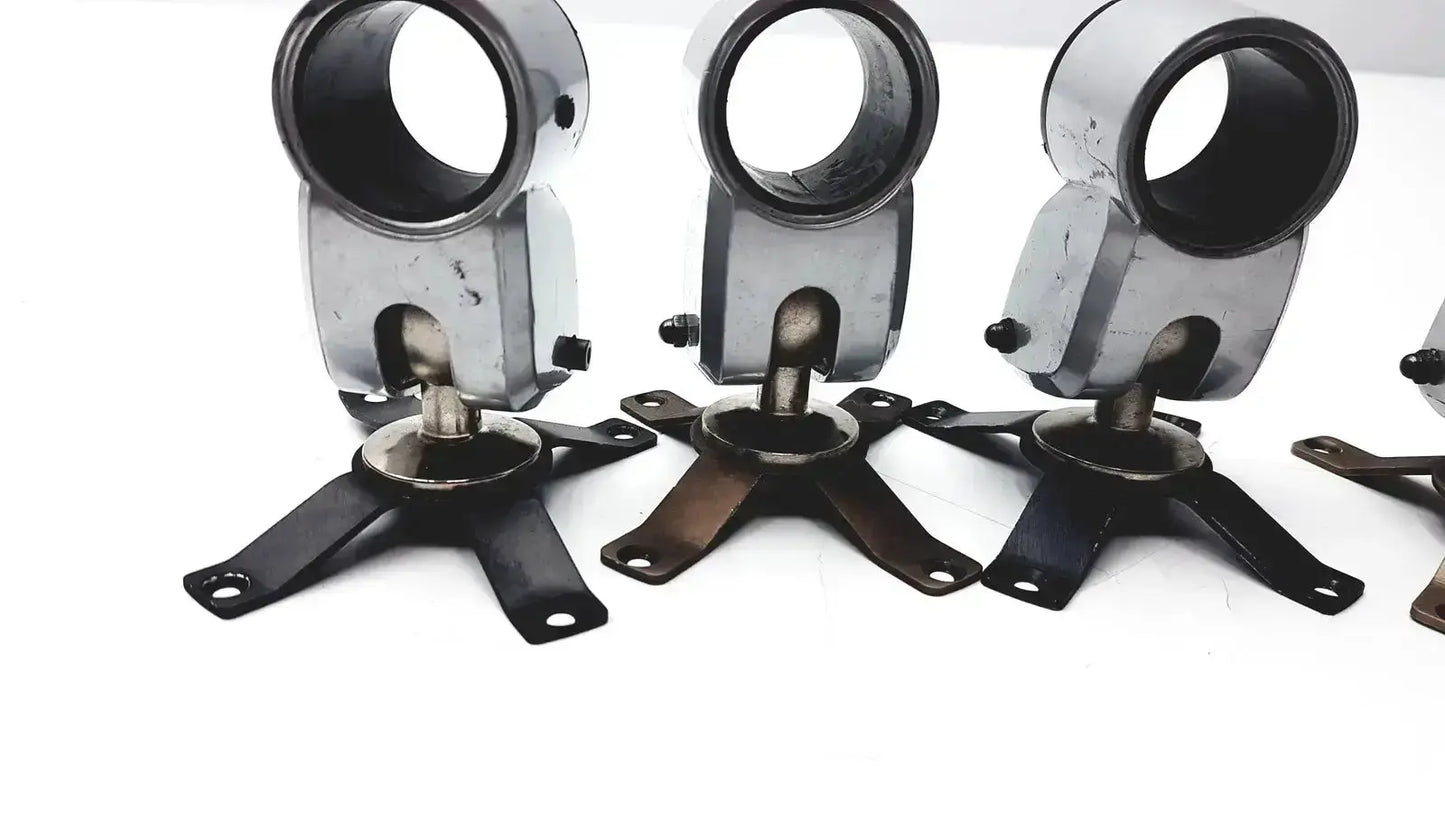 Lot of 5 black and silver metal clamps with circular upper section and four-legged base for hospital surplus equipment