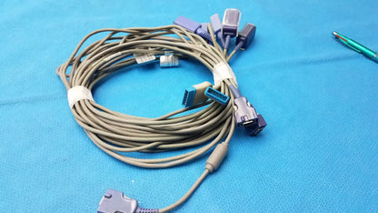 Coiled beige Nellcor spo2 adapter extension cables with multiple connectors including purple and blue plugs lot of 5