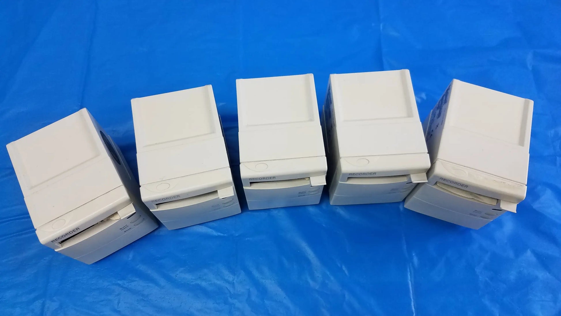Lot of 5 off-white philips m1116b recorder modules with compact design and paper slots for medical equipment use