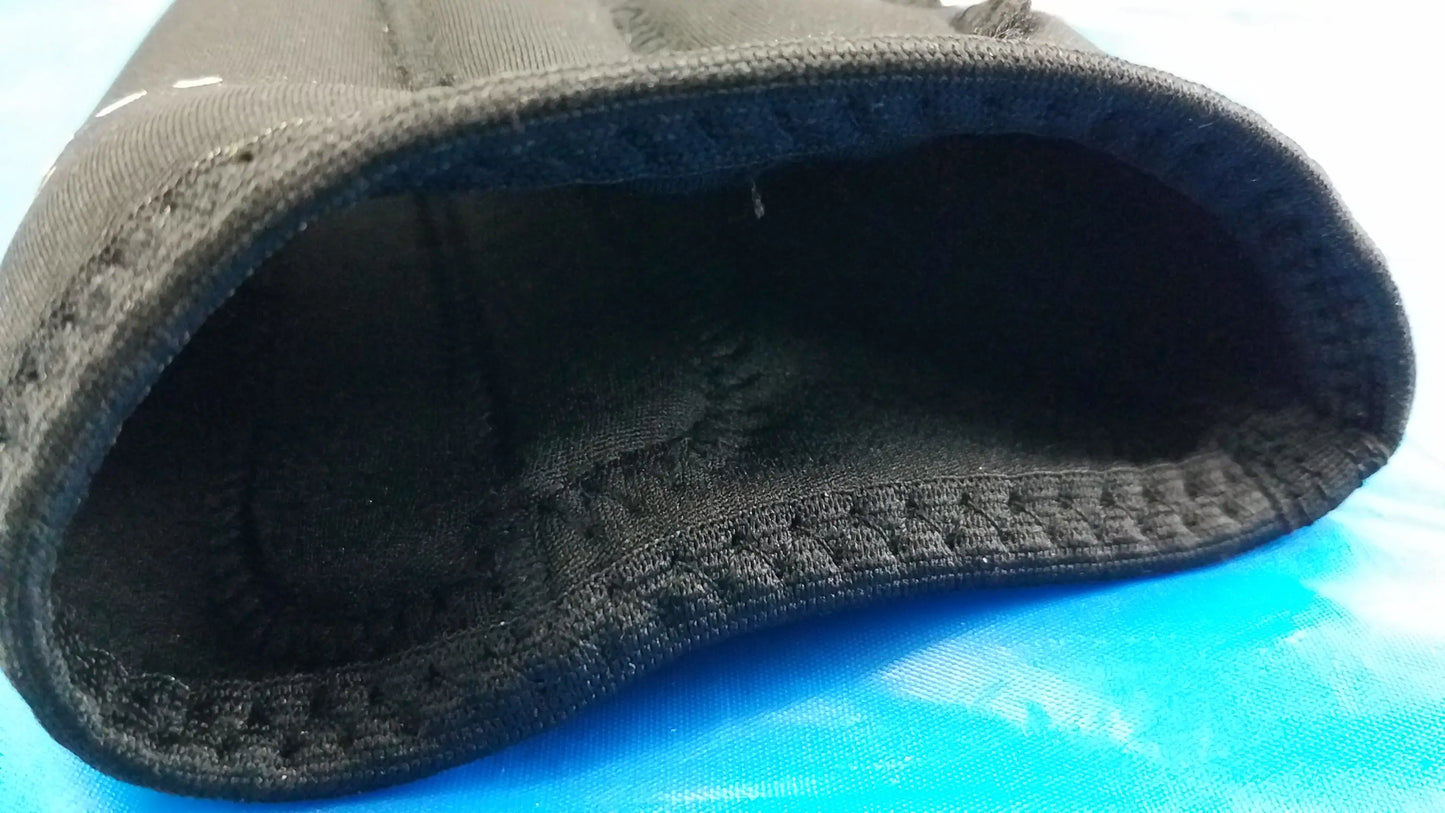 Black neoprene wrist support with textured interior lining as part of medical equipment and corflex cooltex knee sleeves lot