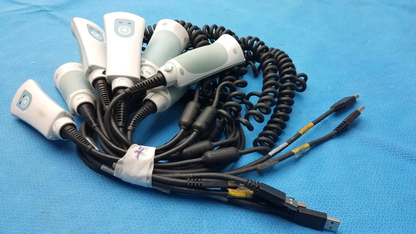 Set of six white and gray welch allyn handheld barcode scanners with coiled black cables for medical use