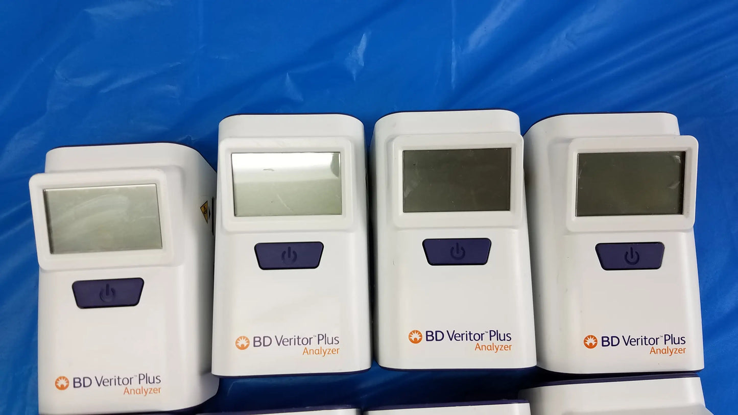 Lot of 8 white bd veritor plus analyzer medical equipment with purple power buttons and small rectangular screens for reuse medical equipment