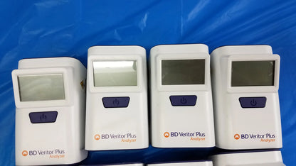 Lot of 8 white bd veritor plus analyzer medical equipment with purple power buttons and small rectangular screens for reuse medical equipment