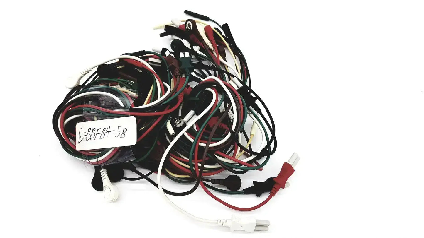 A tangle of multicolored mix mindray compatible ecg leadwires with various connectors and plugs for clinical use
