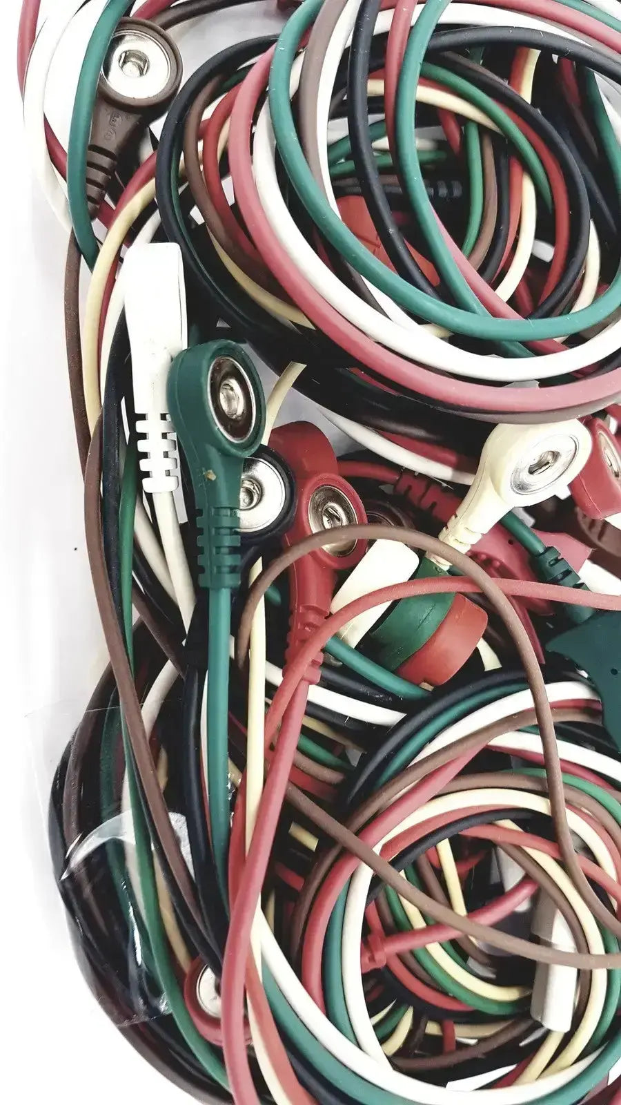 A tangle of colorful insulated mix mindray compatible ecg leadwire cords with metallic connectors in red green black white and brown