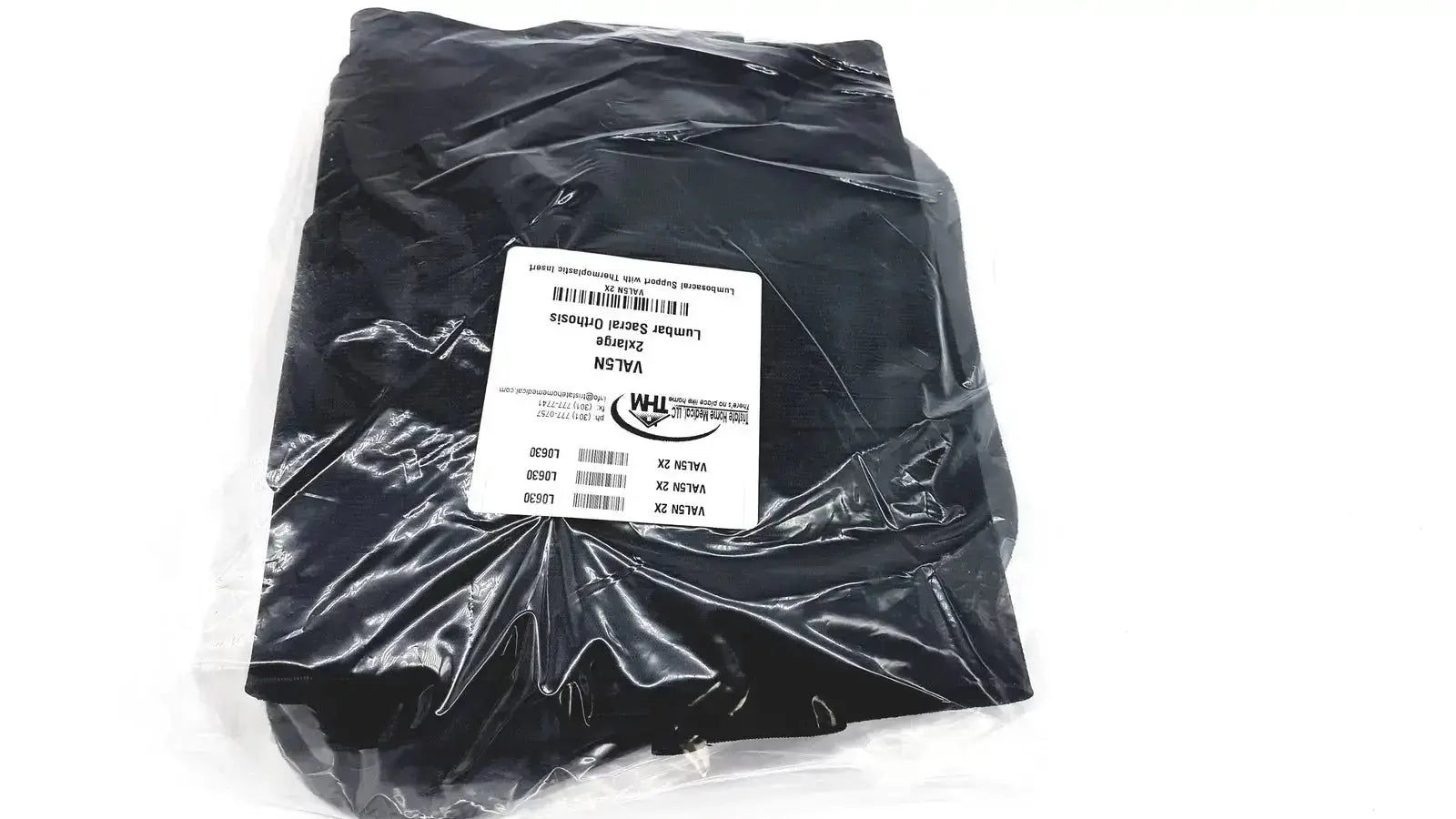 Black nylon lumbar sacral orthosis with thermoplastic insert sealed in clear packaging with white label for lumbosacral support