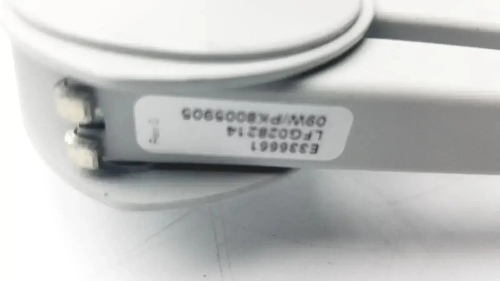 White plastic luxo lfg028214 device with label showing model and serial numbers for lfm led with 3 diopter lens