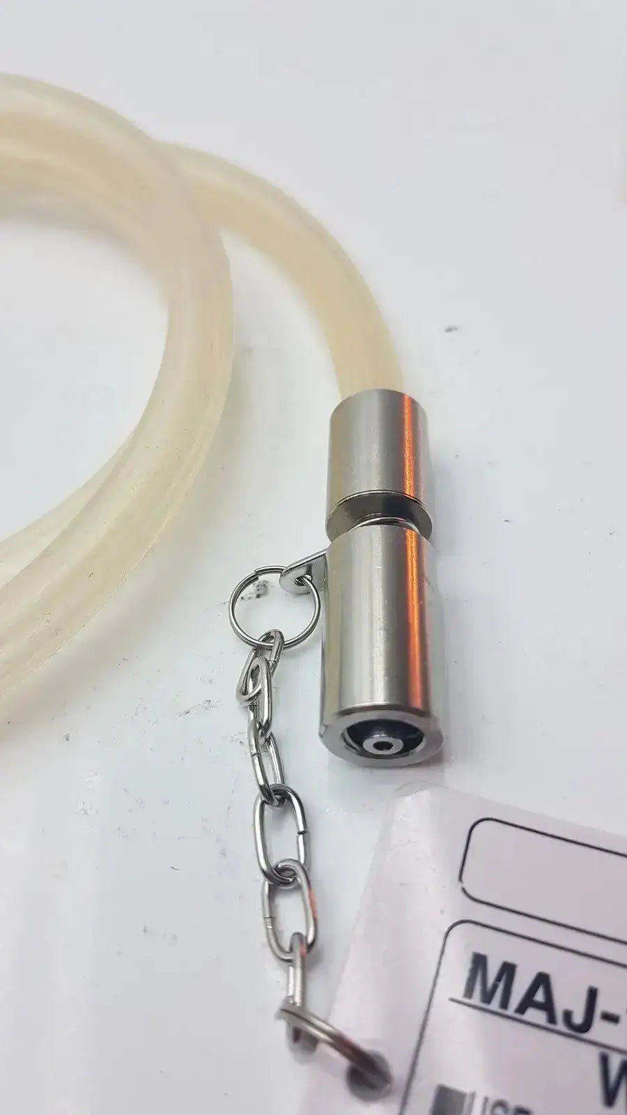 Silver metallic cylindrical valve with chain and translucent tubing for olympus high-flow gas tube fit endoscopic co2 unit