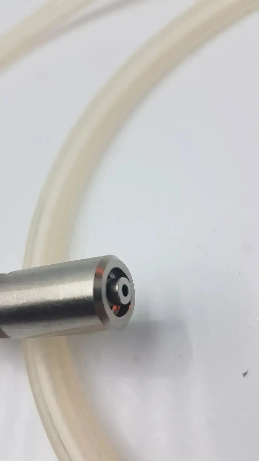 A metallic cylindrical nozzle with polished finish and internal threads for high-flow gas tube fit in olympus ucr unit