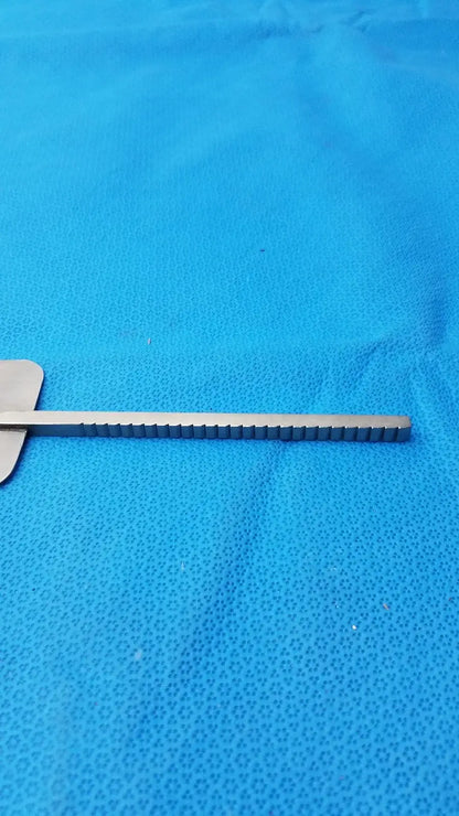 Silver stainless steel malleable retractor blade with flat handle and evenly spaced notches for reuse medical equipment