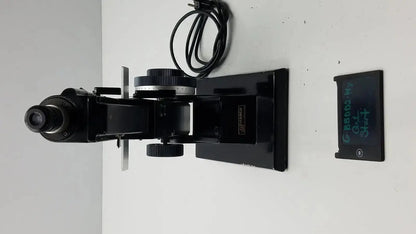 Black metal marco model 101 manual lensmeter with adjustable stage and objective lens for hospital surplus use