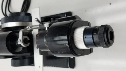 Black and silver microscope objective lens with knurled adjustment rings for marco model 101 manual lensmeter hospital surplus