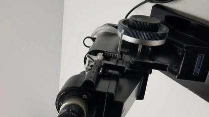 Black metal telescope mount with adjustable knobs and circular scale on marco model 101 manual lensmeter hospital surplus