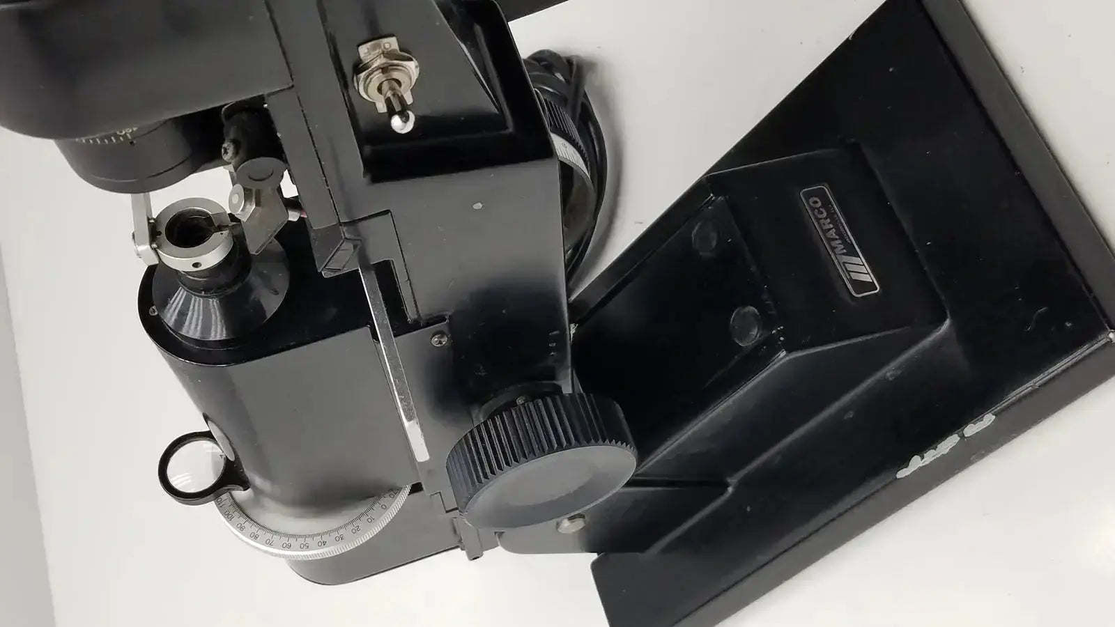 Black metal marco model 101 manual lensmeter with matte finish and adjustable components from hospital surplus