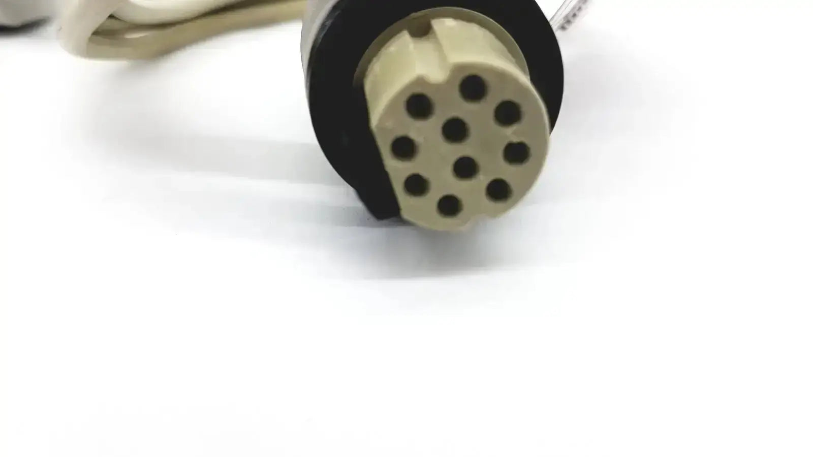 Beige and black 12-pin electrical connector with circular housing for masimo d006 satshare interface cable p n 20323-a04c039