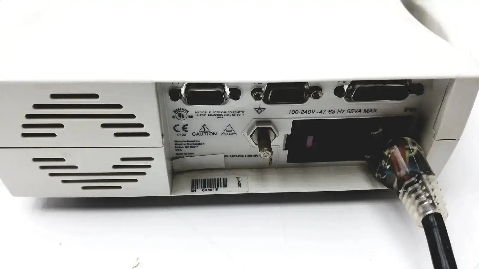 White medical device back with multiple ports and power cord plugged in for masimo set signal extraction pulse oximeter