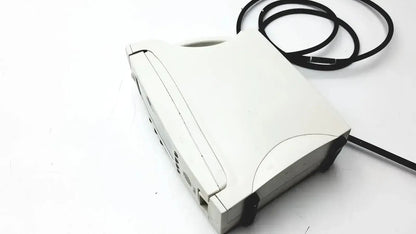 White plastic laptop with black cable coiled beside it in masimo signal extraction pulse oximeter setup
