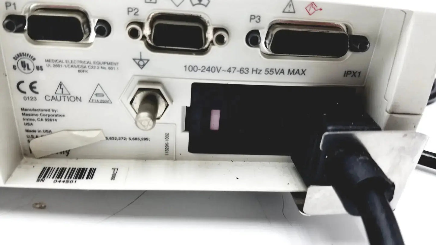 White Masimo signal extraction pulse oximeter backside showing three d-sub connectors power switch and black cable