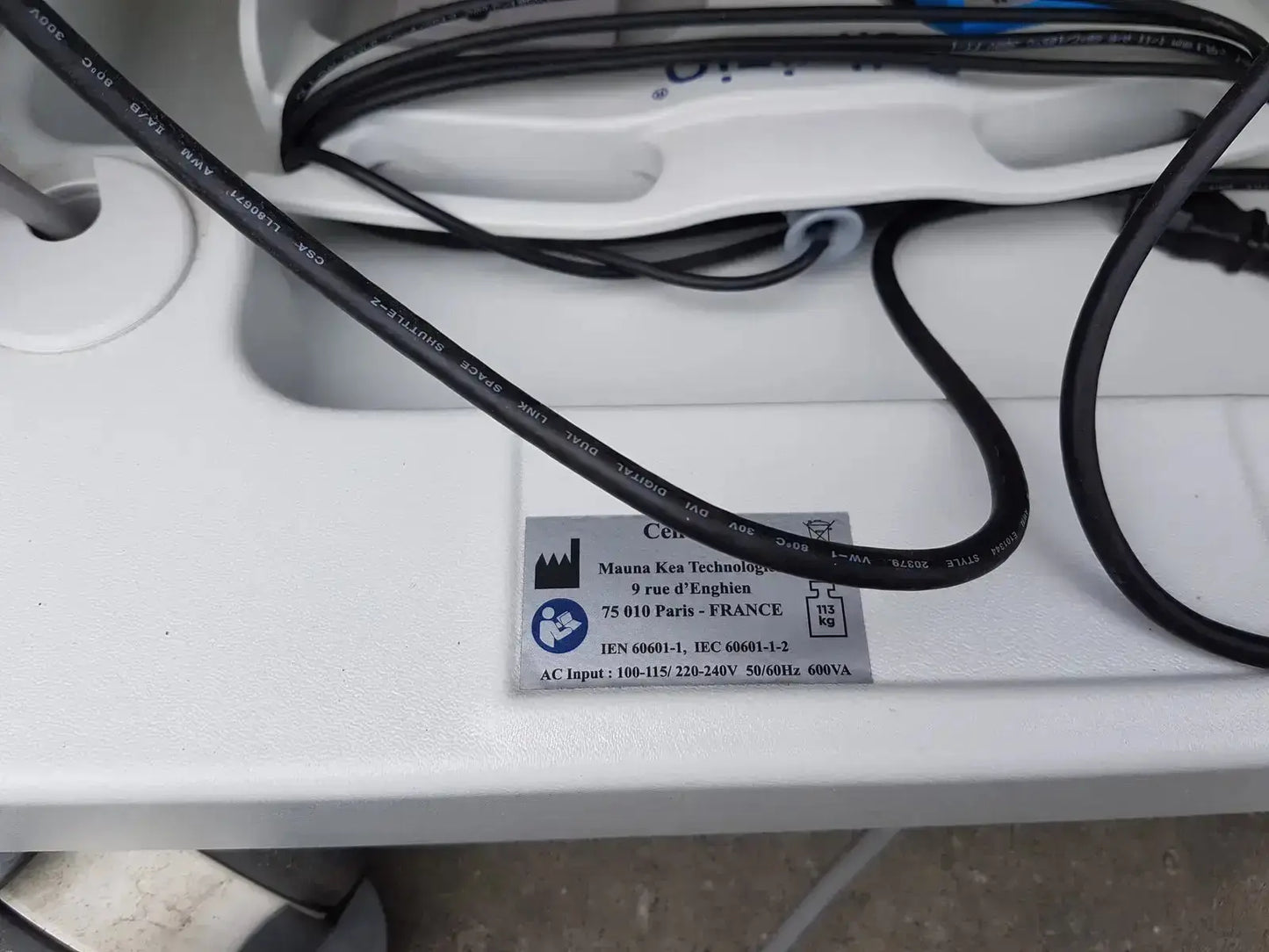 Black electrical cable with printed specifications coiled on white surface for mauna kea technologies cellvizio f-400 v2 manometry system