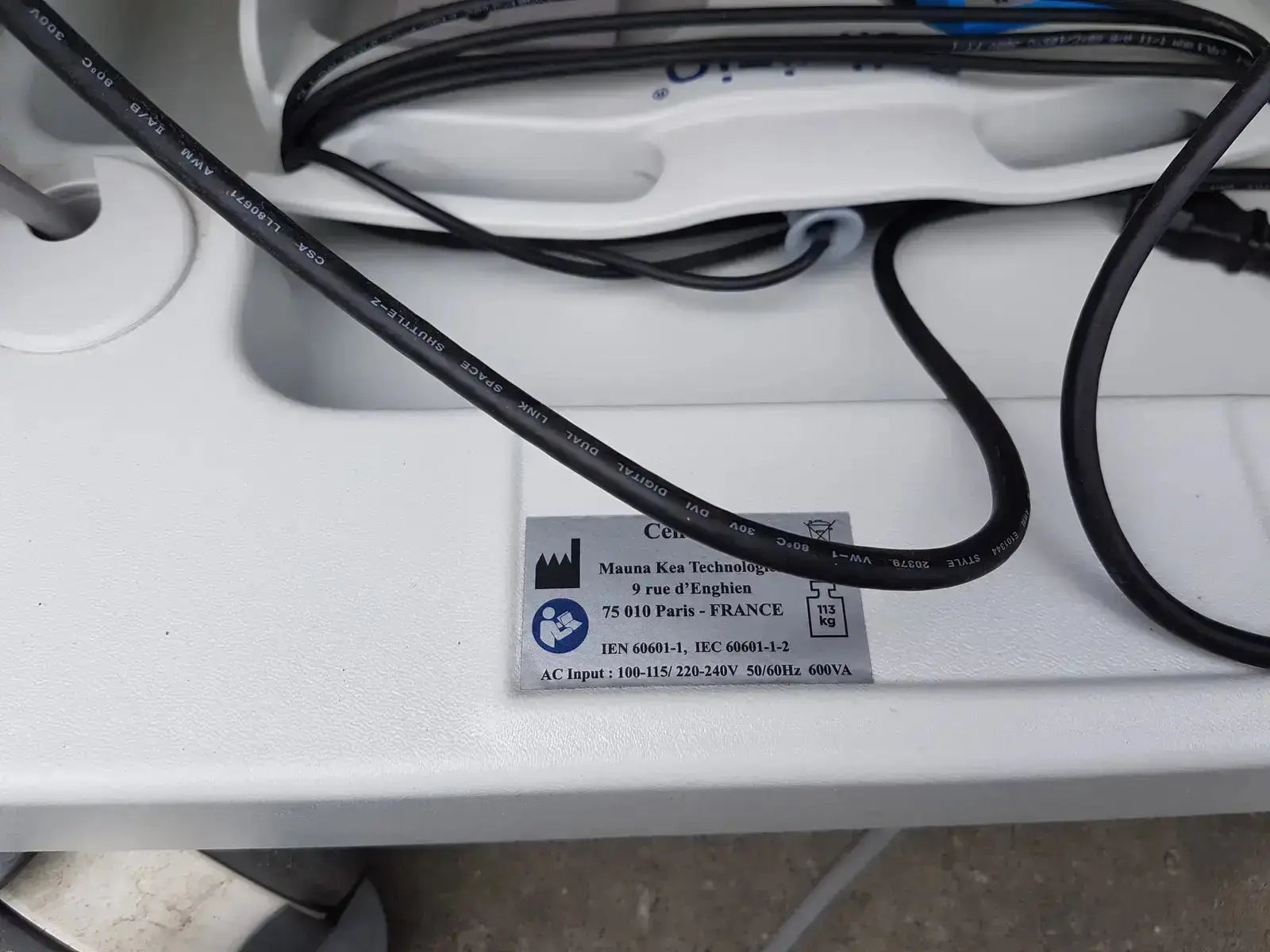 Black electrical cable with printed specifications coiled on white surface for mauna kea technologies cellvizio f-400 v2 manometry system