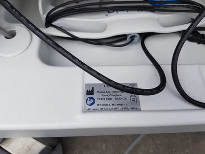 Black electrical cable with printed specifications coiled on white surface for mauna kea technologies cellvizio f-400 v2 manometry system
