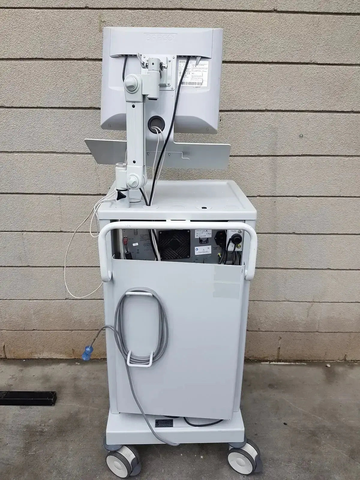 White medical imaging cart with adjustable monitor arm and integrated power supply for mauna kea technologies cellvizio f-400 v2 manometry system