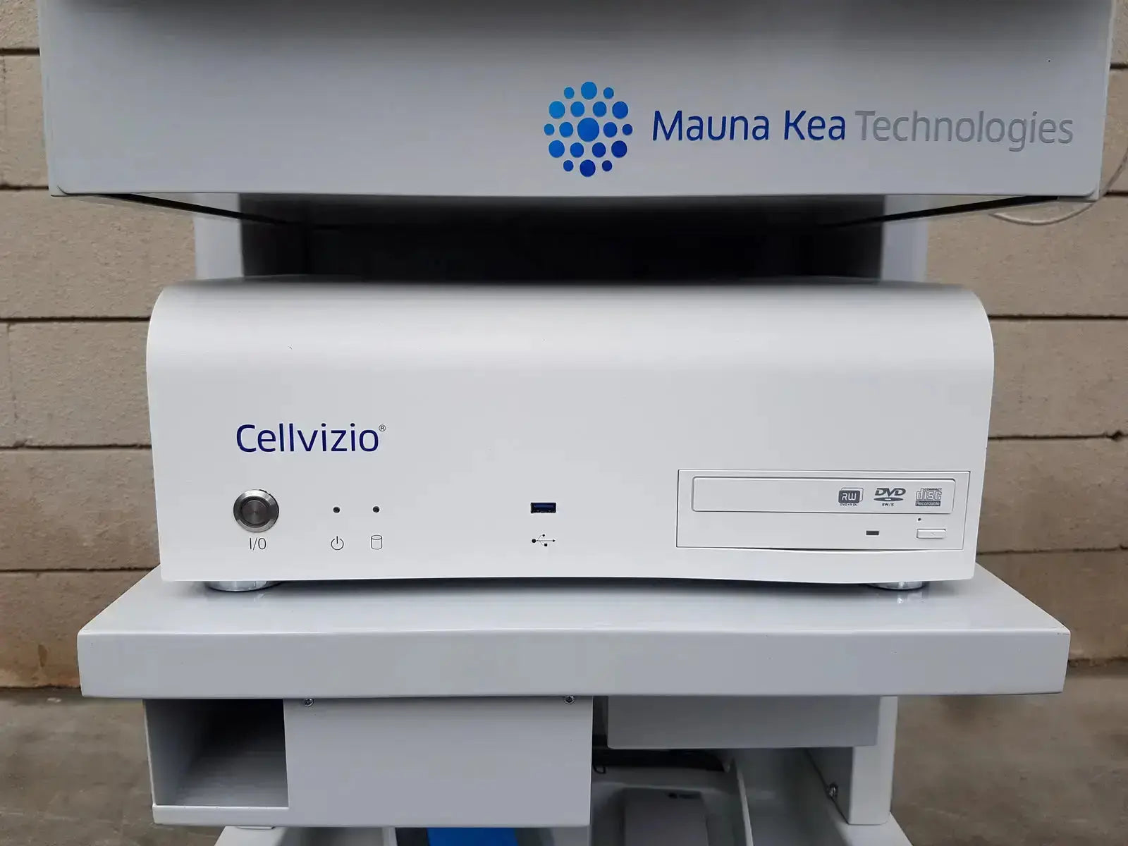 White cellvizio f-400 v2 manometry system by mauna kea technologies with dvd drive and control buttons in white casing