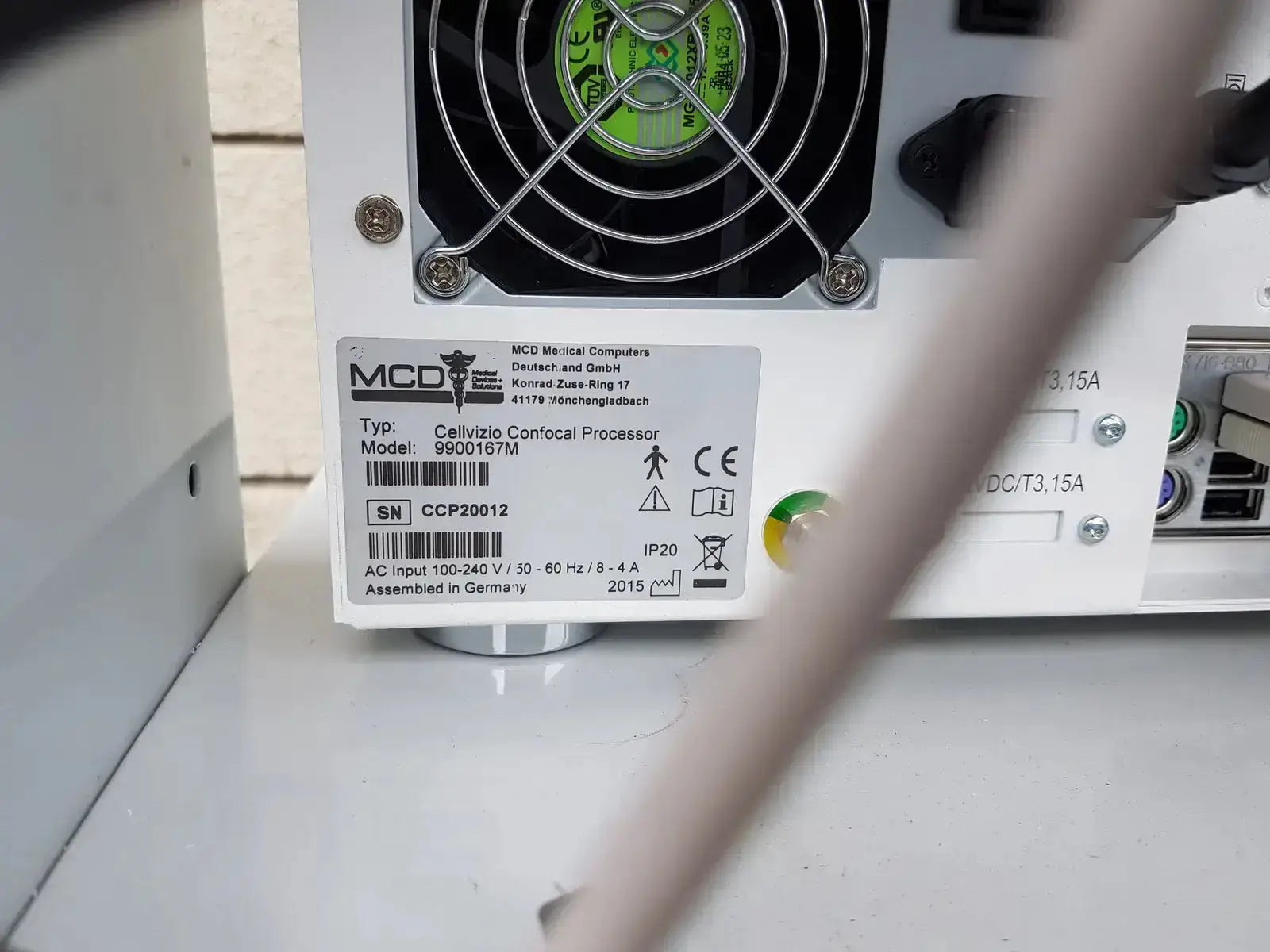 White mcd medial computers cellvizio confocal processor with black fan and green label on back of mauna kea technologies f-400 v2 manometry system