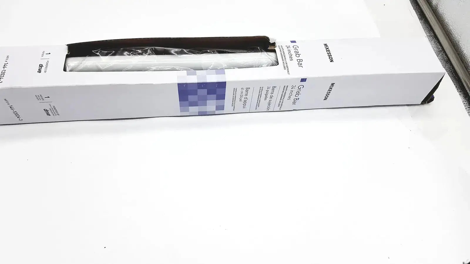 White steel grab bar by mckesson in original packaging designed for wall mounting and safety support