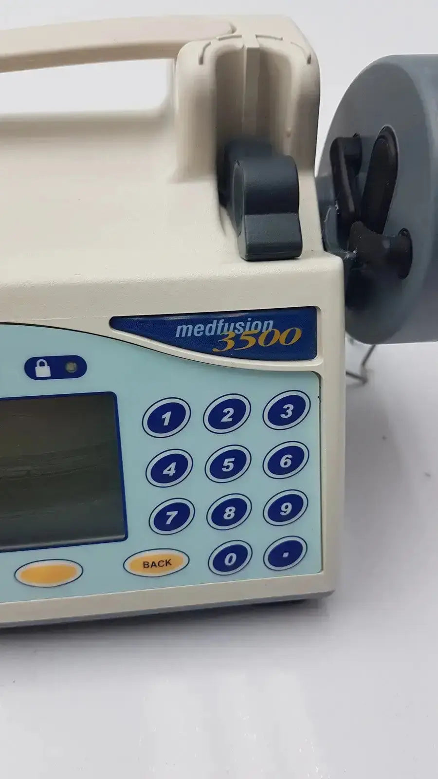 Beige and blue medfusion 3500 infusion pump with digital keypad and pole clamp for hospital surplus biomedical evaluation