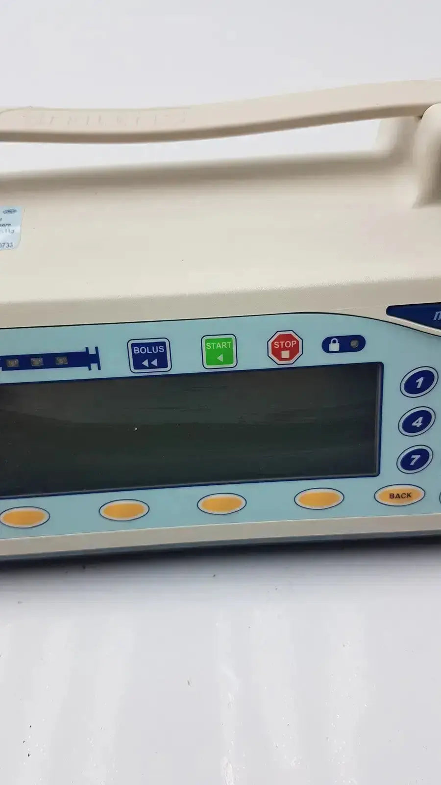 Beige medfusion 3500 medical infusion pump with light blue control panel and pole clamp for hospital surplus biomedical evaluation
