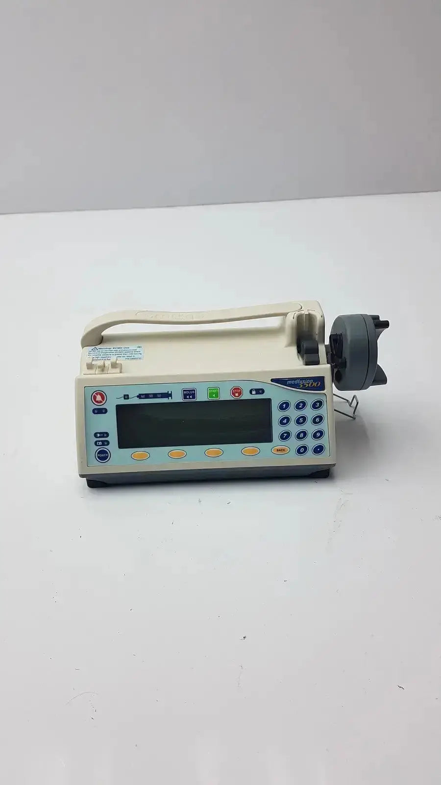 Beige medfusion 3500 infusion pump with digital display keypad and pole clamp for hospital surplus biomedical evaluation