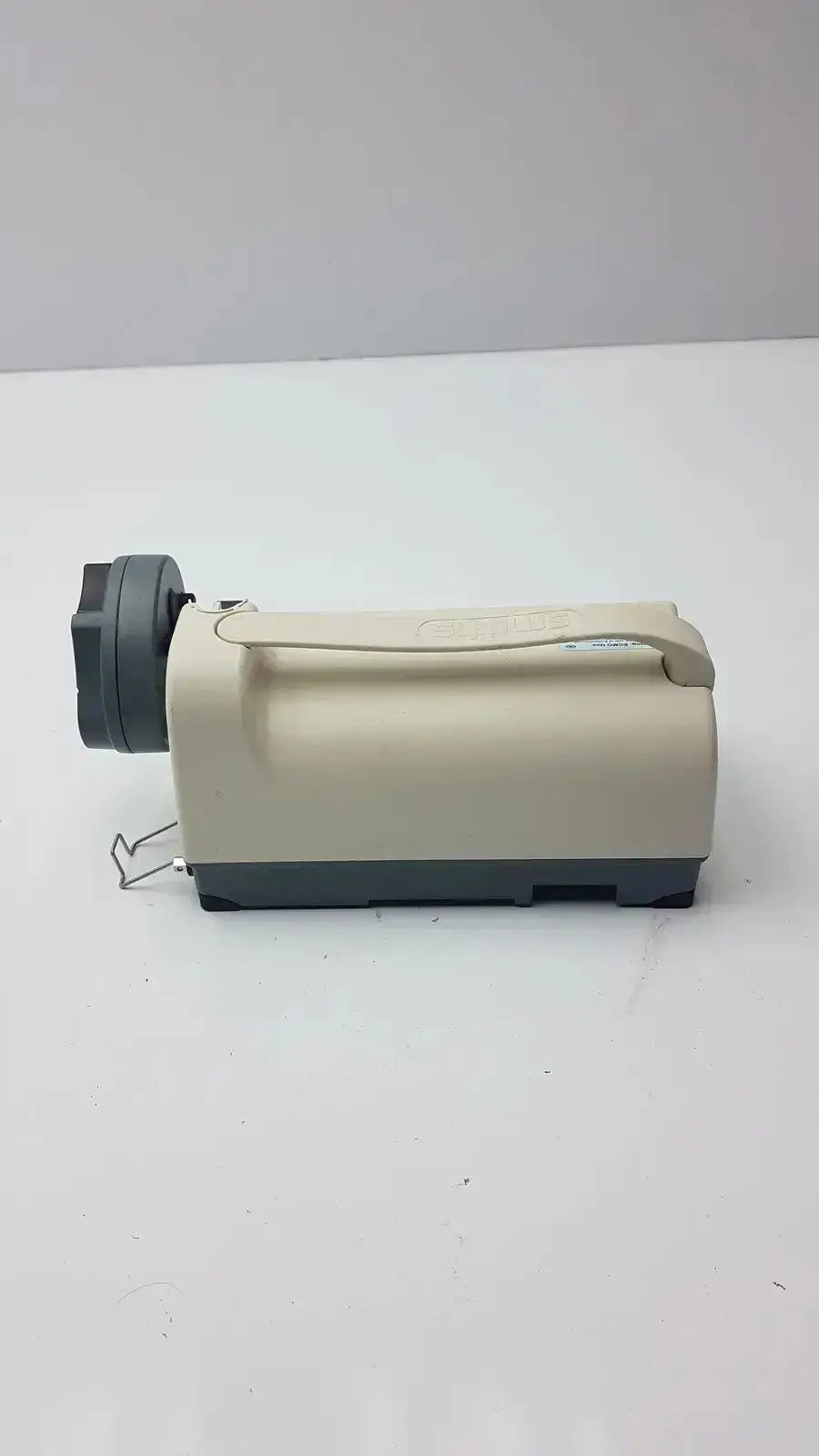 Beige and gray medfusion 3500 handheld biomedical device with retractable handle and pole clamp for hospital surplus evaluation