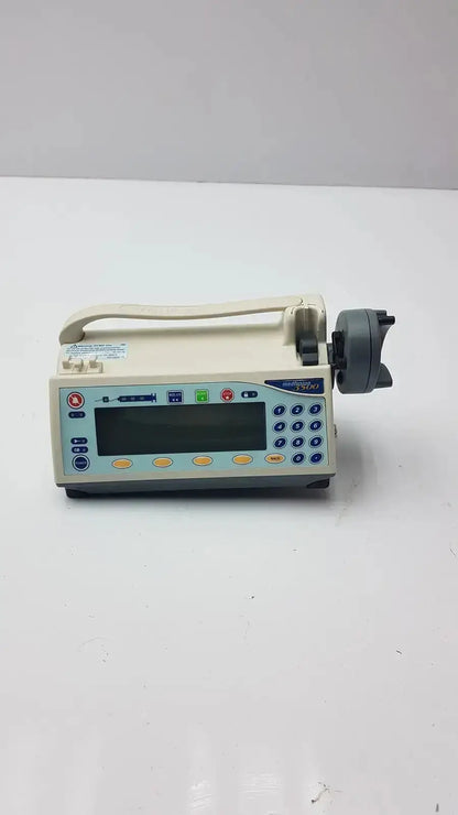 Beige medfusion 3500 medical infusion pump with digital display colorful buttons and gray pole clamp for hospital surplus use