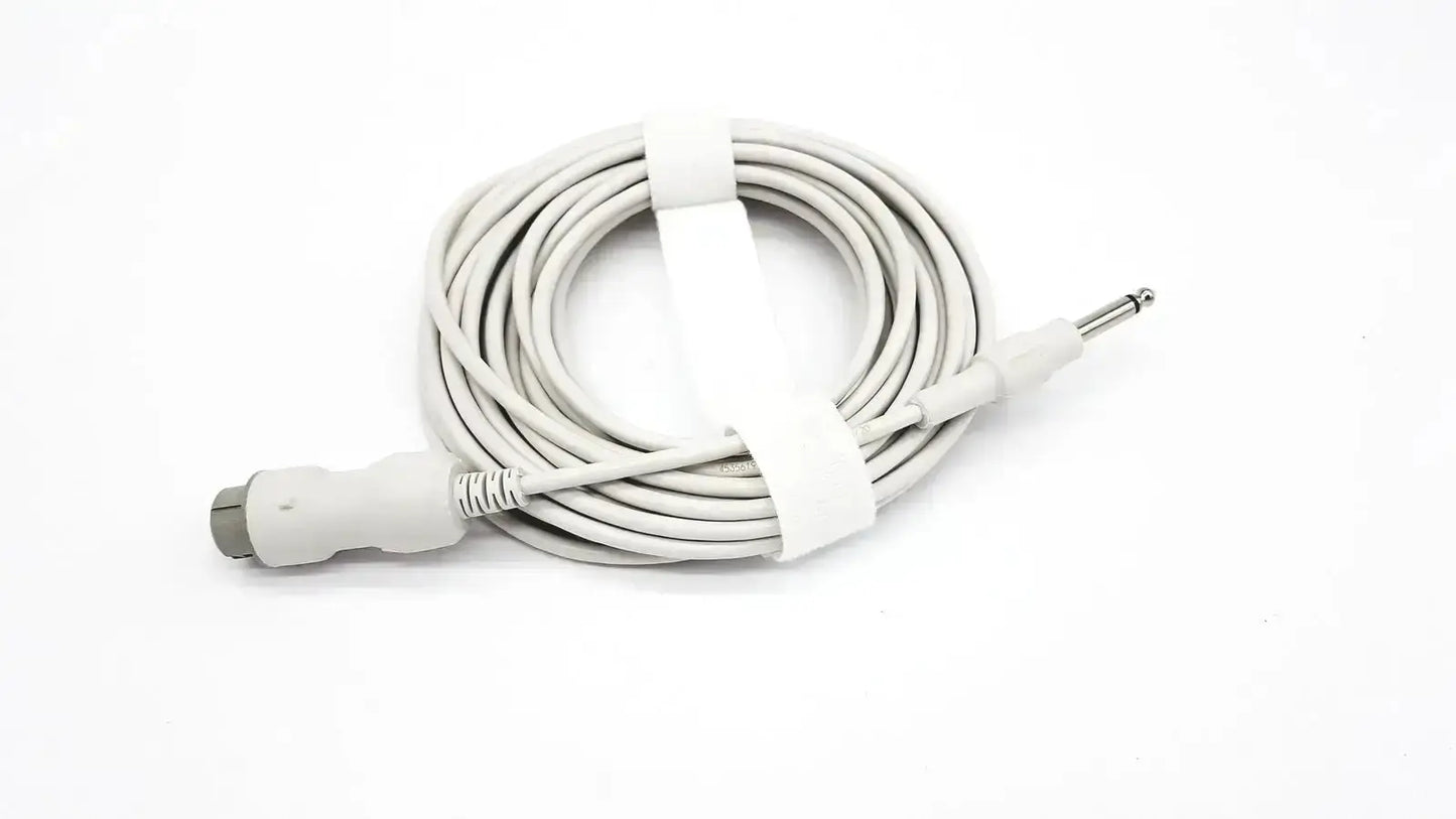 White coiled reusable bare copper wire ibp cable with gray connector and silver 6.35mm jack secured by white tie