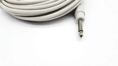 A coiled white ibp cable with reusable bare copper wire and a metallic 6.35mm jack for mindray medical use